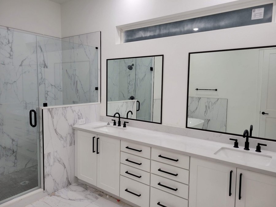 Glas Plus mirrors example: two mirrors with black frames over a white double vanity