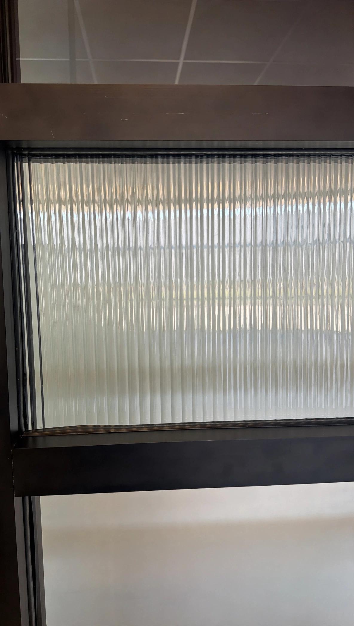 Glas Plus decorative cabinet glass example: reeded glass in a dark frame