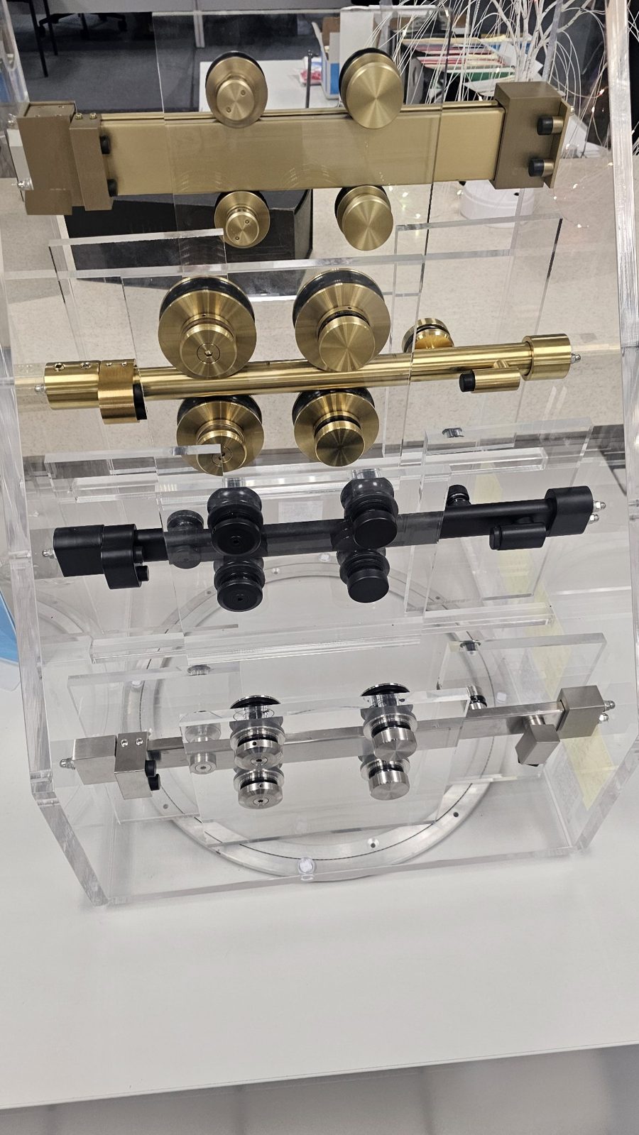 Glas Plus complete sliding systems display: gold kit on top and gold, black and chrome rollers
